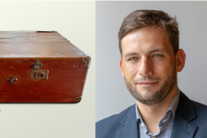 Dr. Swen Steinberg and a suitcase from the "Queen's Refuge" exhibit