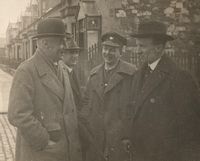Buchan with other men in the city
