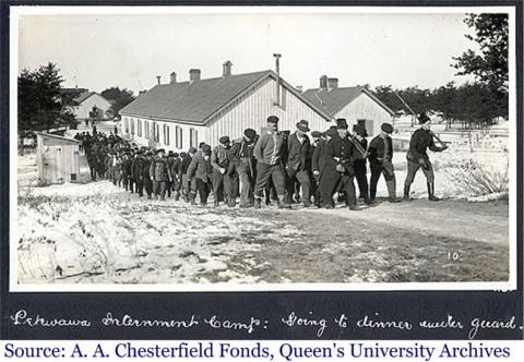 Photograph of internees being marched off to dinner at the Petawawa Internment Camp during WWI